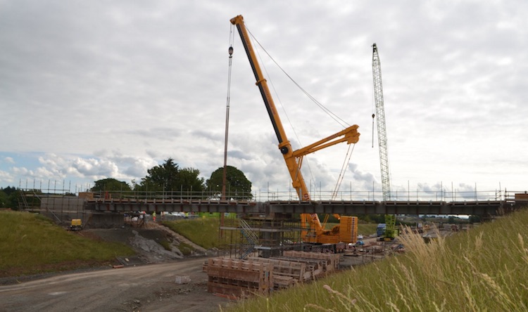 Dobbins lane bridge seen from the far
                          side with crane lifting.