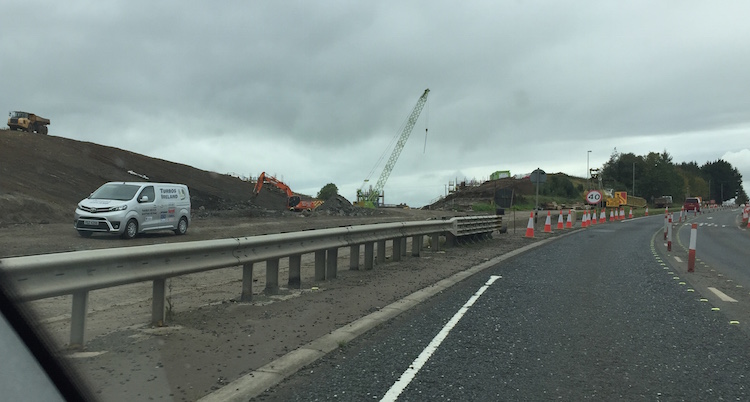 View east from M22 towards large
                          excavation in bank.