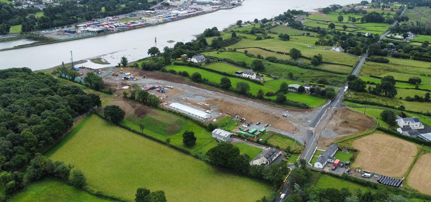 Aerial view with Newry river on left and
                          R173 on right. Work site extends full length
                          between them.